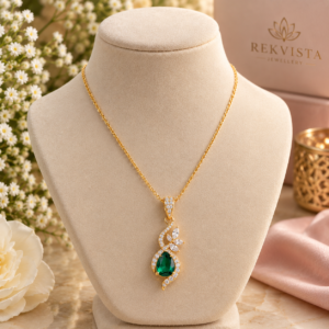 Emerald ribbon pendant with green emerald detail